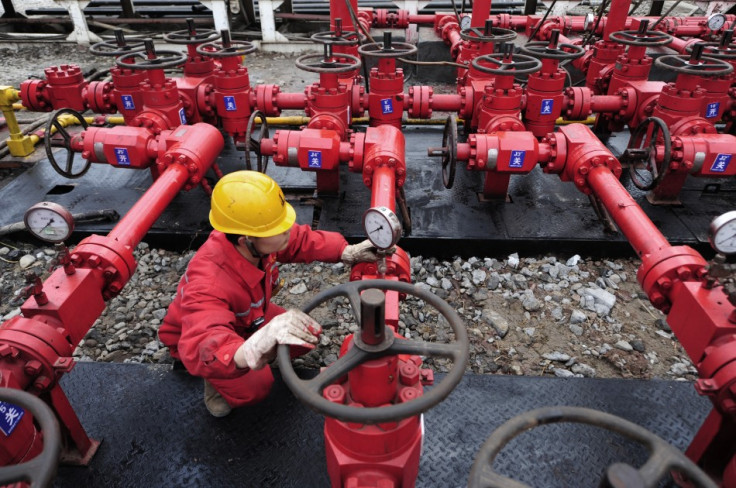 A worker performs a routine check to the valves at a natural gas appraisal well of Sinopec in Langzhong county, Sichuan province March 1, 2011. China, which has by far the world?s largest shale deposits, has just started to exploit this source of unconven