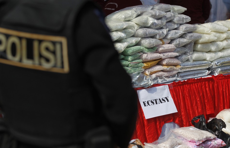 Jakarta police's narcotics division prepare to destroy drugs, which comprised of 362.45 kilograms of crystal methamphetamine, 1,052,000 ecstasy pills, and 118.27 kilograms of marijuana