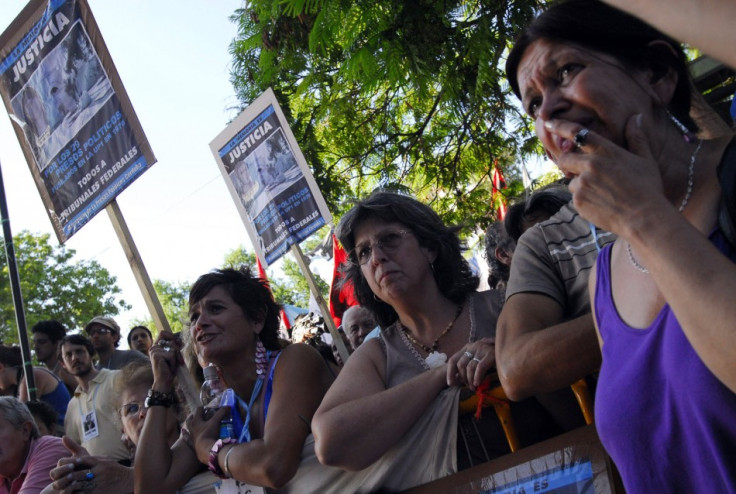 People await the verdict on the trial of former Argentine dictator Jorge Videla outside a courthouse in the province of Cordoba,