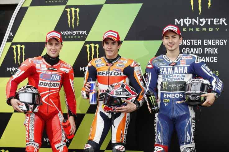 Marquez flanked by Dovizioso (L) and  Lorenzo