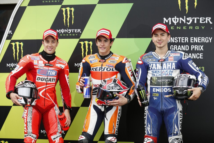 Marquez flanked by Dovizioso (L) and Lorenzo