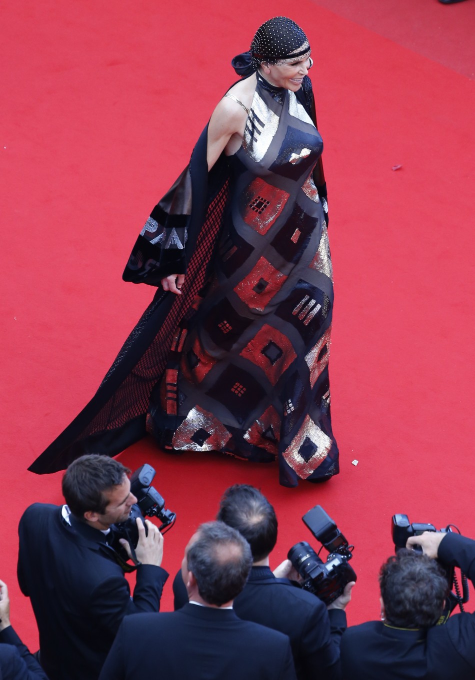 Lebanese businesswoman Mouna Ayoub poses on the red carpet as she arrives for the screening of the film Inside Llewyn Davis in competition during the 66th Cannes Film Festival in Cannes May 19, 2013.