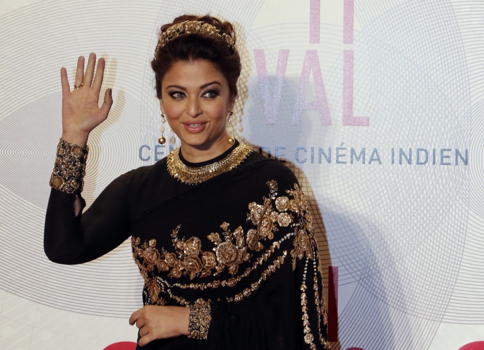 Indian actress Aishwarya Rai poses as she arrives at the evenings gala of the film Bombay Talkies celebrating a hundred years of Indian cinema, during the 66th Cannes Film Festival in Cannes May 19, 2013.
