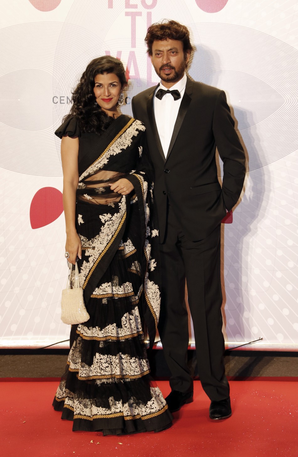 Actress Nimrit Kaur L and actor Irrfan Khan pose as they arrive at the evenings gala of the film Bombay Talkies celebrating a hundred years of Indian cinema, during the 66th Cannes Film Festival in Cannes May 19, 2013