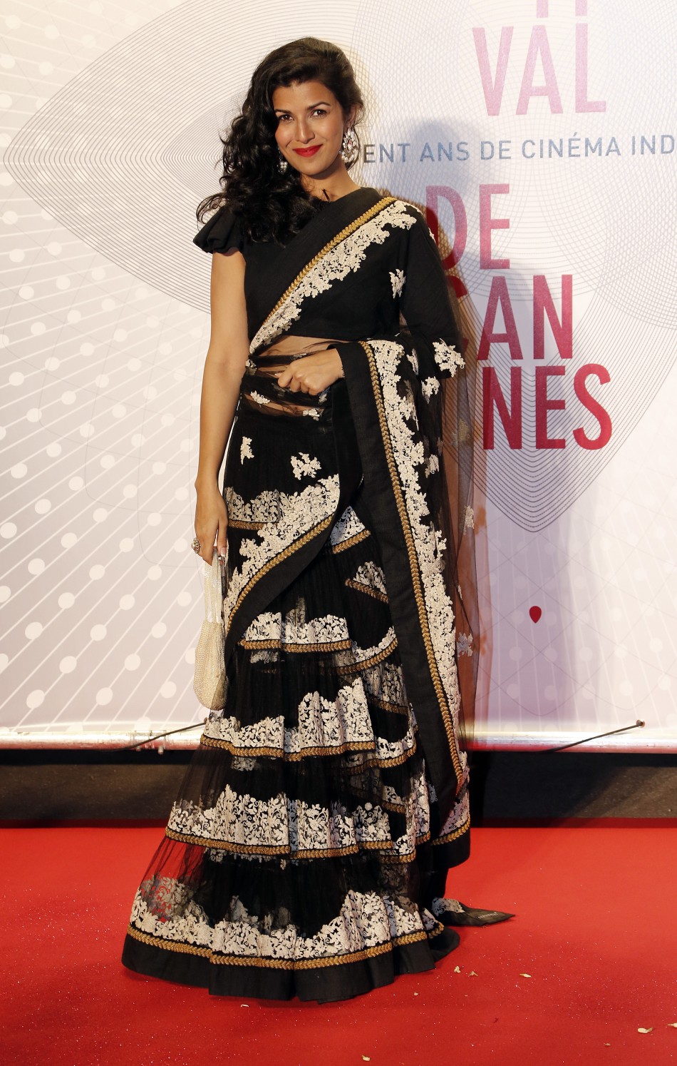 Actress Nimrit Kaur poses as she arrives at the evenings gala of the film Bombay Talkies celebrating a hundred years of Indian cinema, during the 66th Cannes Film Festival in Cannes May 19, 2013.