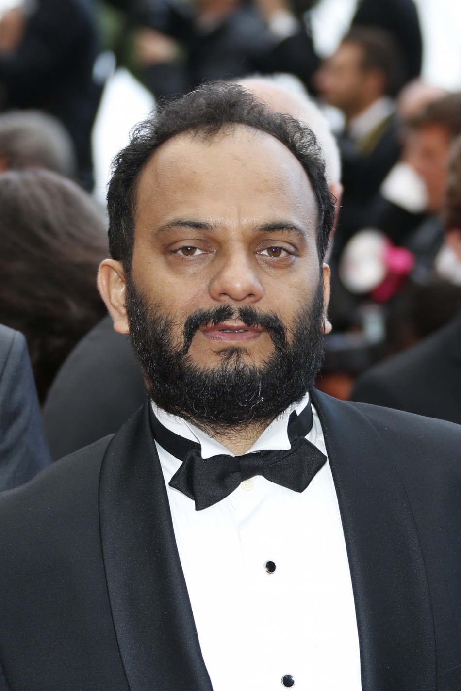 Director Amit Kumar poses on the red carpet as he arrives for the screening of the film Bombay Talkies and the evenings gala celebrating a hundred years of Indian cinema, during the 66th Cannes Film Festival in Cannes May 19, 2013.