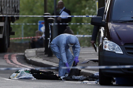 A police forensics officer investigates a crime scene where one man was killed in Woolwich, southeast London(Reuters)