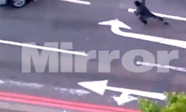 Knifeman Michael Adebolajo dashes headlong at police with arm raised to strike