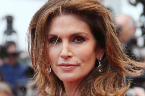 Model Cindy Crawford poses on the red carpet as she arrives for the screening of the film 'The Great Gatsby' and for the opening ceremony of the 66th Cannes Film Festival in Cannes