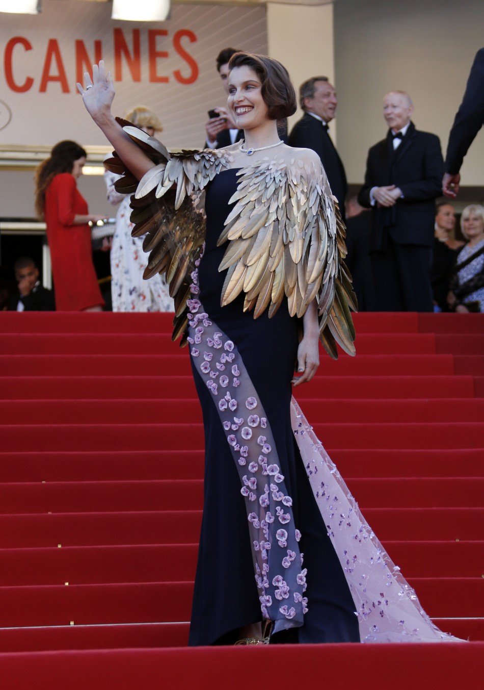 Actress Laetitia Casta poses on the red carpet as she arrives at the closing ceremony of the 66th Cannes Film Festival in Cannes May 26, 2013.