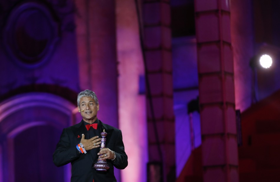 Former U.S. Olympic diver Greg Louganis performs during the opening ceremony