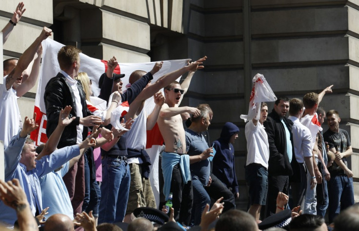 English Defence League demonstrators shout and gesture during a protest in Whitehall (Reuters)