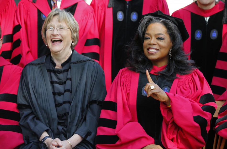 Media mogul Oprah Winfrey R sits with Harvard President Drew Faust before the 362nd Commencement ceremony at Harvard University in Cambridge, Massachusetts May 30,