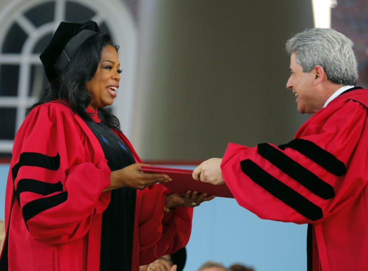 Oprah Winfrey accepts an honorary Doctor of Laws degree from Marc Goodheart (R), Vice President and Secretary of the University following in the footsteps of Harry Potter author JK Rowling and Microsoft founder Bill Gates