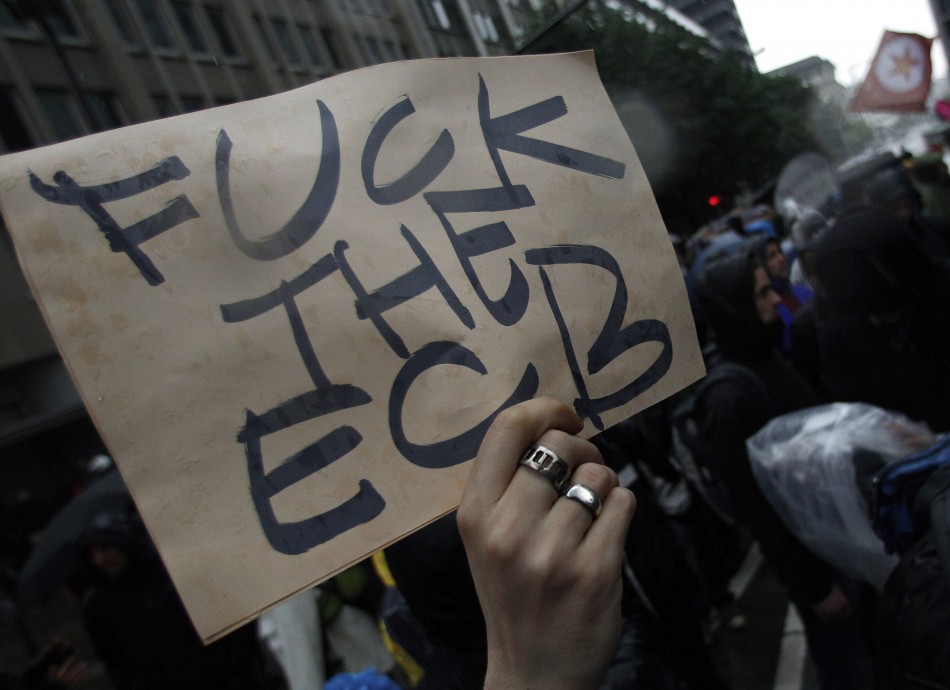 A protester holds up a placard during an anti-capitalist Blockupy demonstration