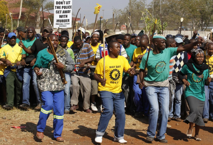 Members of the mining community march during a strike at Lonmin's Marikana platinum mine in Rustenburg, 100 km (62 miles) northwest of Johannesburg, May 15, 2013. (Photo: Reuters)