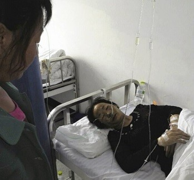 An injured woman lies on a bed at a hospital in Changchu (Reuters)