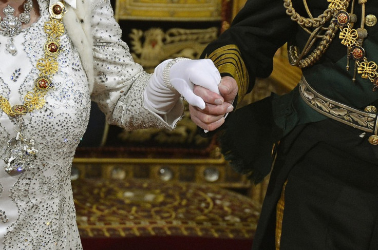 Prince Philip take's the Queen's hand at her speech at Westminster