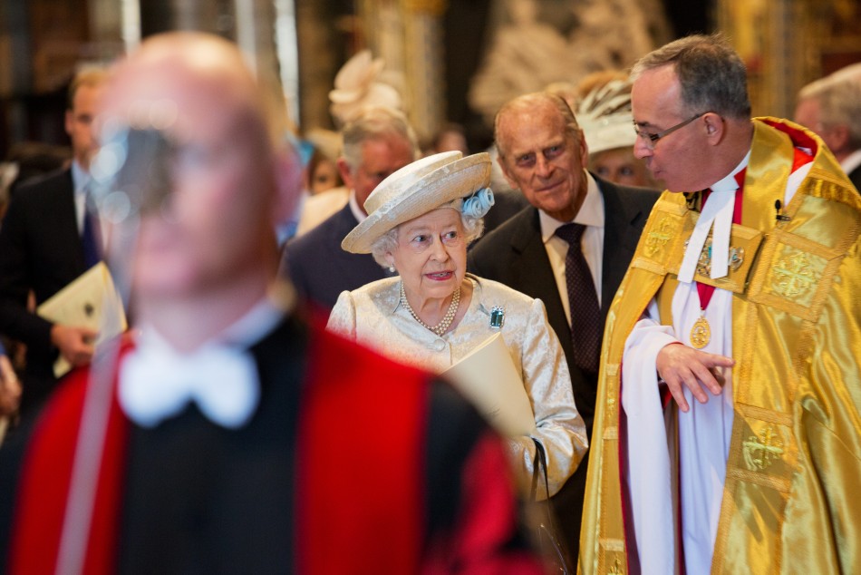 Queen Elizabeth 3rd R and Prince Philip 2nd R are accompanied by the Dean of Westminster, John Hall R, as they attend a service celebrating the 60th anniversary of the Queens coronation at Westminster Abbey in London June 4, 2013.