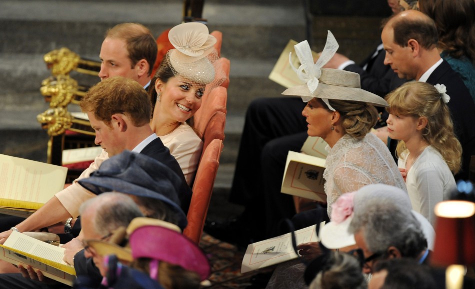 Catherine, Duchess of Cambridge L CENTRE smiles as she sits between her husband Prince William L TOP and Prince Harry during a service celebrating the 60th anniversary of Queen Elizabeths coronation at Westminster Abbey in London June 4, 2013.