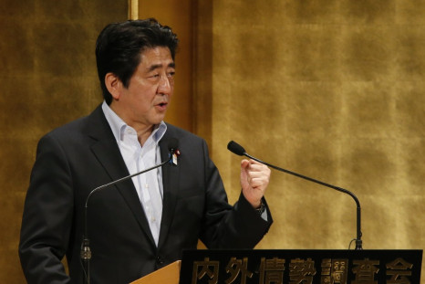 Japan's PM Abe delivers a speech at a seminar in Tokyo