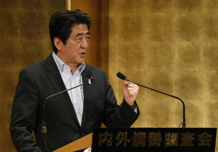 Japan's PM Abe delivers a speech at a seminar in Tokyo