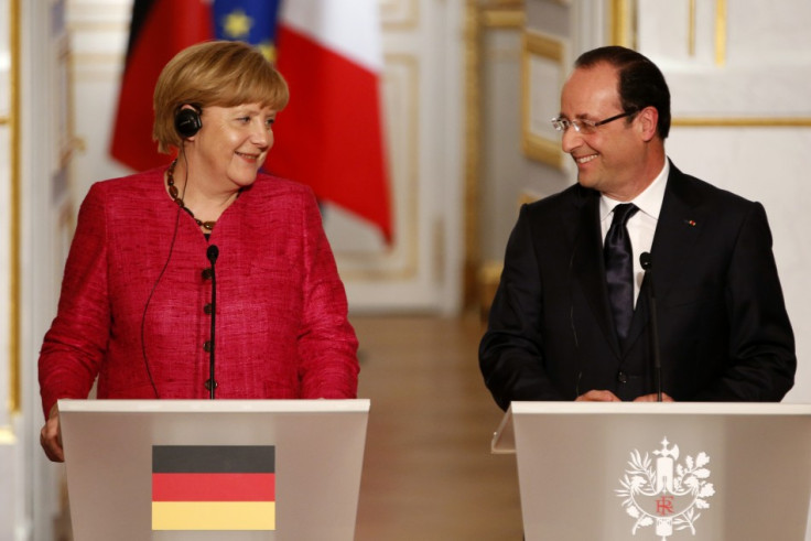 France's President Francois Hollande (R) and German Chancellor Angela Merkel attend a joint news conference at the Elysee Palace in Paris, May 30, 2013 (Photo: Reuters)