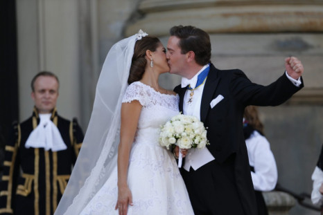 Sweden's Princess Madeleine kisses U.S.-British banker Christopher O'Neill outside the royal church after their wedding ceremony in the royal castle in Stockholm
