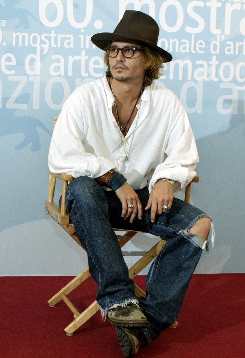 Johnny Depp poses during a photo call at Venice Lido August 28, 2003.