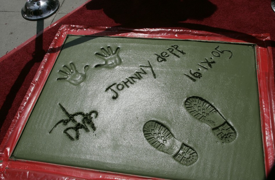 Johnny Depps signature, handprints and footprints in cement are pictured after ceremonies at the forecourt of Graumans Chinese Theatre in Hollywood September 16, 2005.