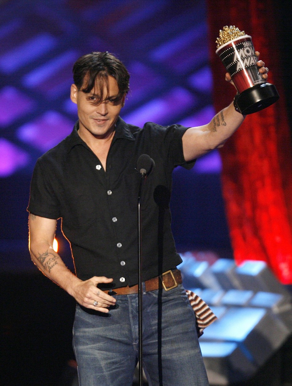 Johnny Depp accepts his award for best villain for his role in Sweeney Todd The Demon Barber of Fleet Street at the 2008 MTV Movie Awards in Los Angeles June 1, 2008.