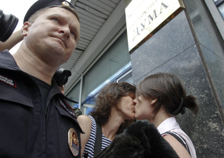 Gay rights activists kiss during a protest outside Parliament (Reuters)