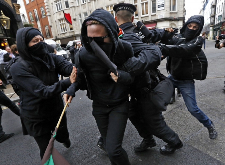 Protesters, demonstrating against the upcoming G8 summit, scuffle with police in central London (Reuters)