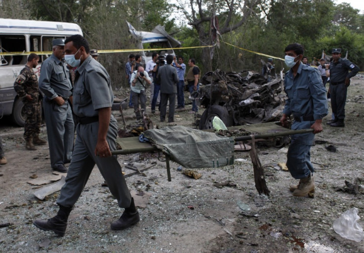 Emergency crews remove victims from Kabul supreme court bombing