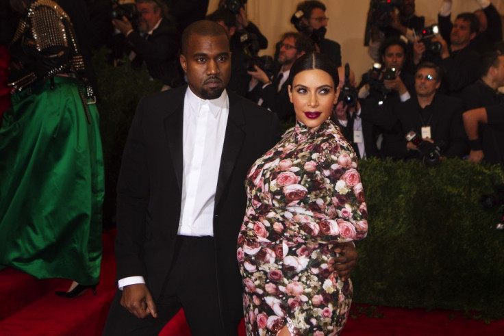 Kanye West and Kim Kardashian (R)