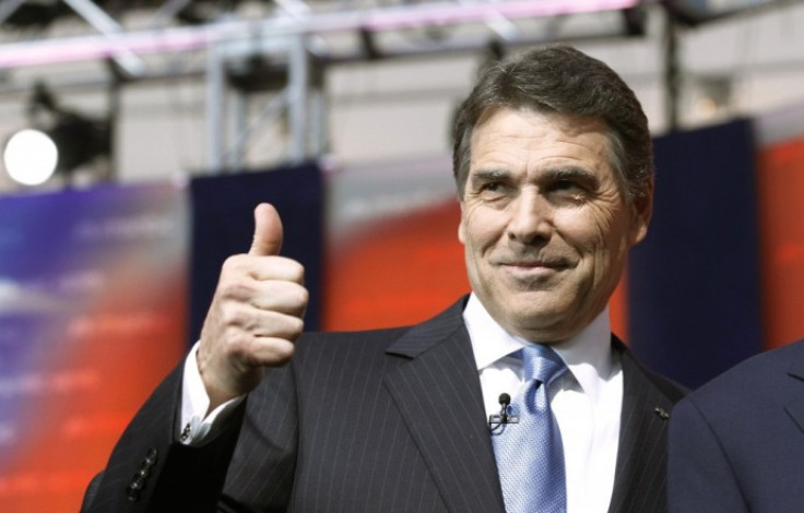 Texas Governor Rick Perry gives a thumbs up as he stands on stage before the Reagan Centennial GOP presidential primary debate at the Ronald Reagan Presidential Library in Simi Valley, California September 7, 2011.