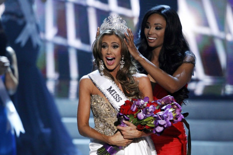 Miss Connecticut Erin Brady reacts as she is crowned by Miss USA 2012 Nana Meriwether during the Miss USA pageant at the Planet Hollywood Resort and Casino in Las Vegas, Nevada June 16, 2013.