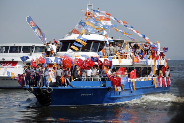 Supporters of Prime Minister Tayyip Erdogan's ruling AK party arrive by boat for a rally in Istanbu