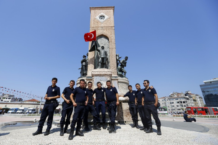 Turkish police pose for a picture at Taksim Square in Istanbul