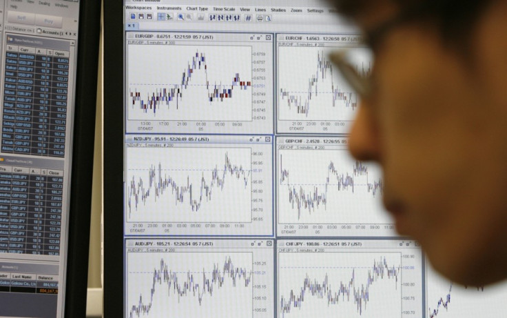 A currency dealer (unrelated to the IBTimes UK story) observes foreign currency market movements in Tokyo July 5, 2007 (Photo: Reuters)