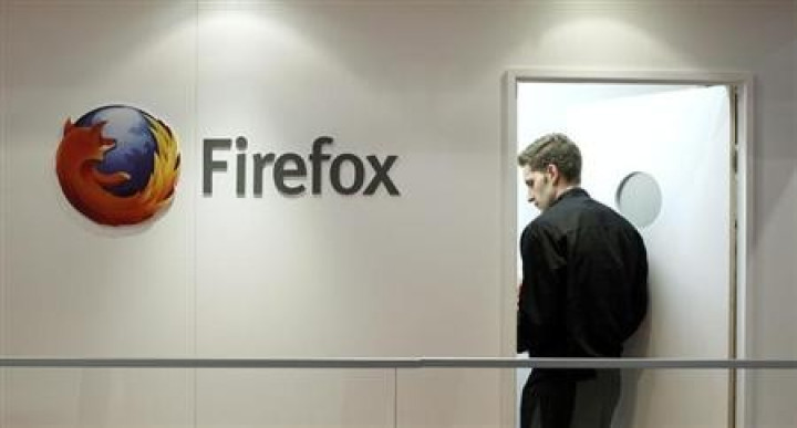 A man is seen next to a Firefox logo at a Mozilla stand during the Mobile World Congress in Barcelona, February 28, 2013. A man is seen next to a Firefox logo at a Mozilla stand during the Mobile World Congress in Barcelona, February 28, 2013.
