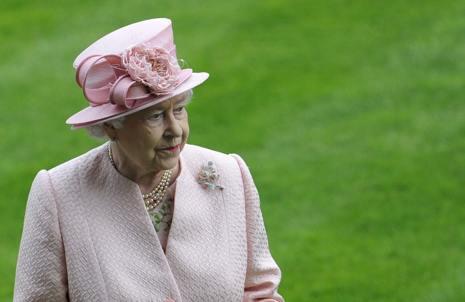 Britains Queen Elizabeth observes a minute silence for Henry Cecil at Ascot race course in southern England June 18, 2013.