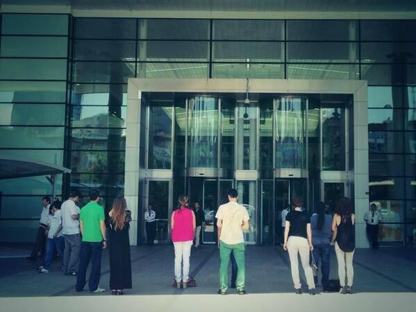 People standing in front of TV stations in Turkey