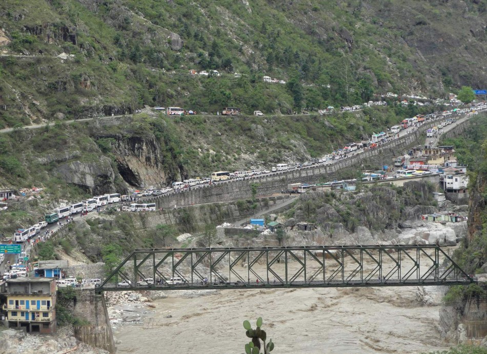 Stranded vehicles stand in queues after heavy rains in the Himalayan state of Uttarakhand June 17, 2013.