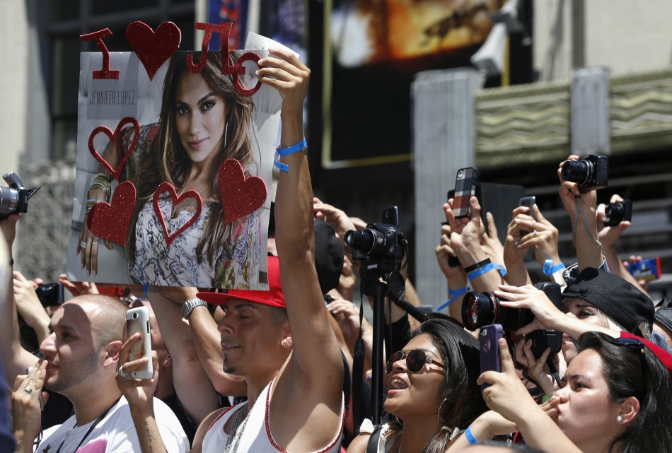 Fans cheer during the ceremony for the unveiling of singer and actress Jennifer Lopezs star on the Walk of Fame in Hollywood, California June 20, 2013.