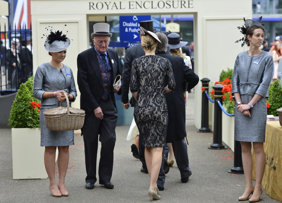 racegoers as they arrive at the Royal Enclosure for ladies day at the Royal Ascot horse racing festival at Ascot, southern England