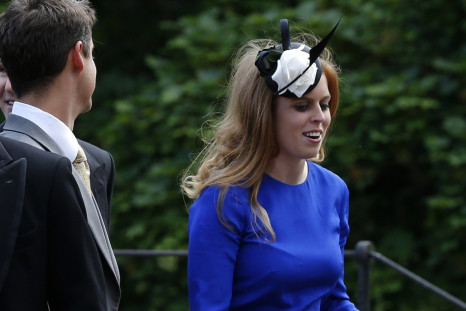 Princess Beatrice (R) arrives for the wedding
