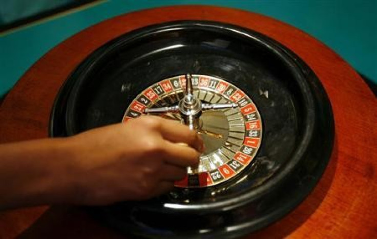 A dealer spins a roulette wheel at a mock casino where no money was used during the launch ceremony of "Ten Hotels" by Dawnay Day in New Delhi April 28, 2008.