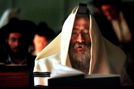 Orthodox Jewish Rabbi B. Lesches prays with some of the trainees from the Rabbinical College at the Yeshiva Synangogue in Sydney
