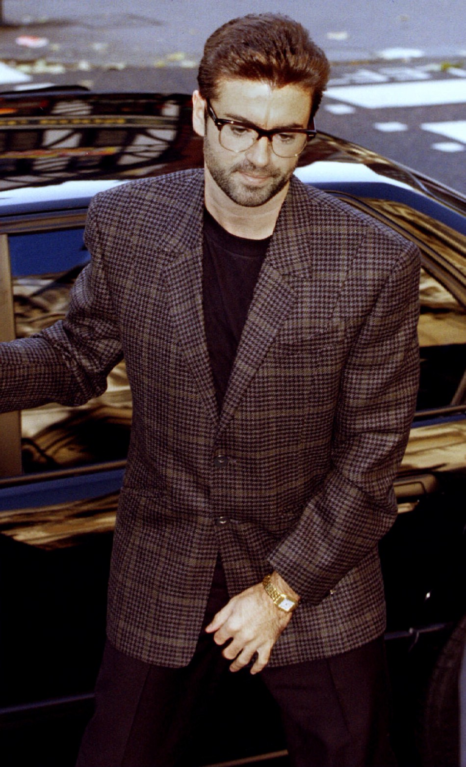 Singer George Michael arrives at the High Court for the second day of his bid to break from Sony Music Entertainment October 19.1993